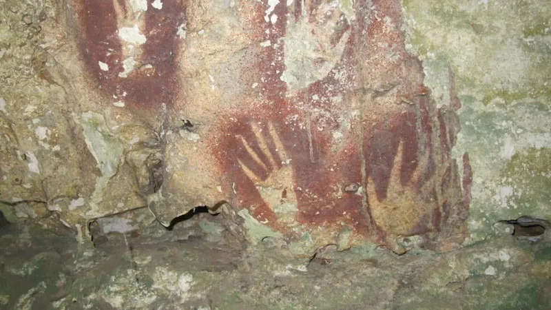 Oldest known rock art is a 68,000-year-old hand stencil with claws