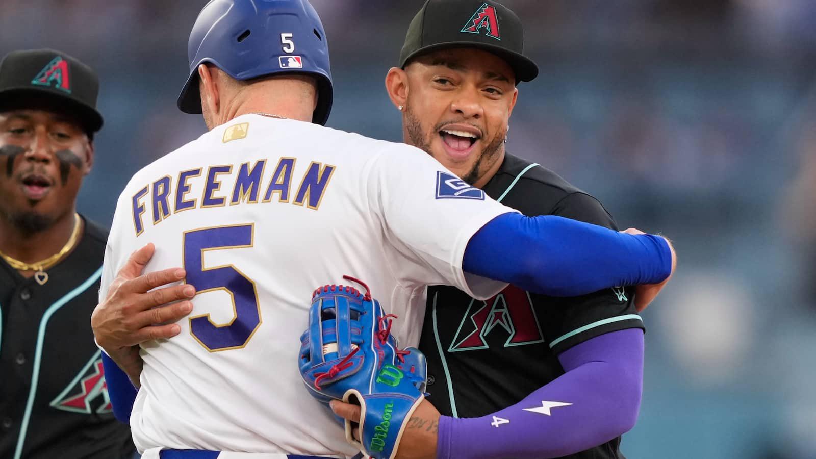 Dodgers' Freddie Freeman gets tagged out with a hug after snapping 0-for-8 skid