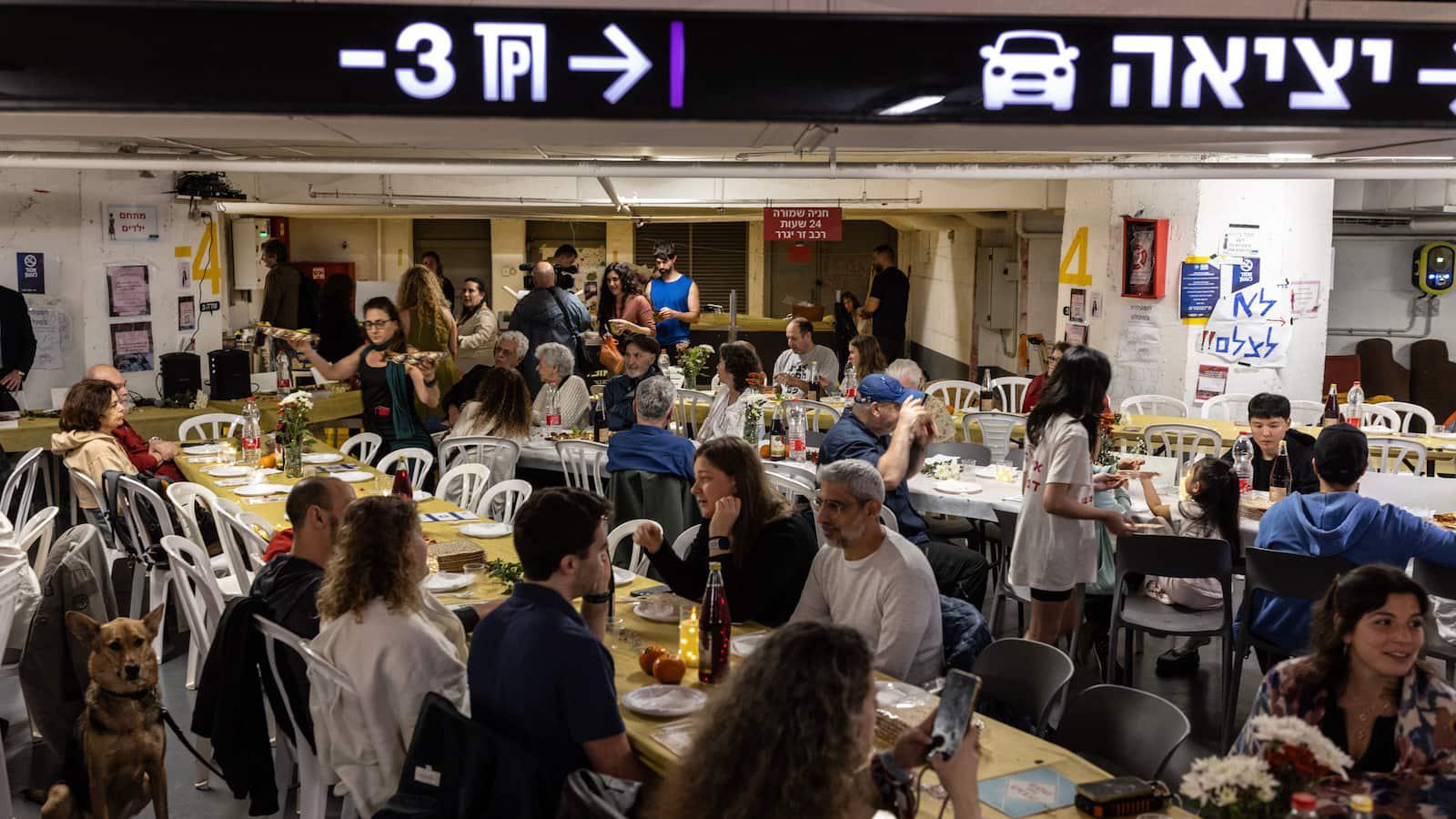 Israelis celebrate Passover in a parking garage turned bomb shelter